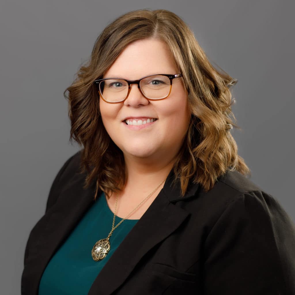 lindsey hendrickson smiling in a suit coat