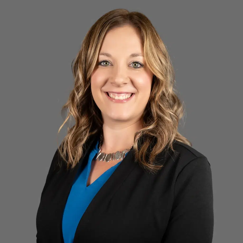 paige logslett smiling in a suit coat