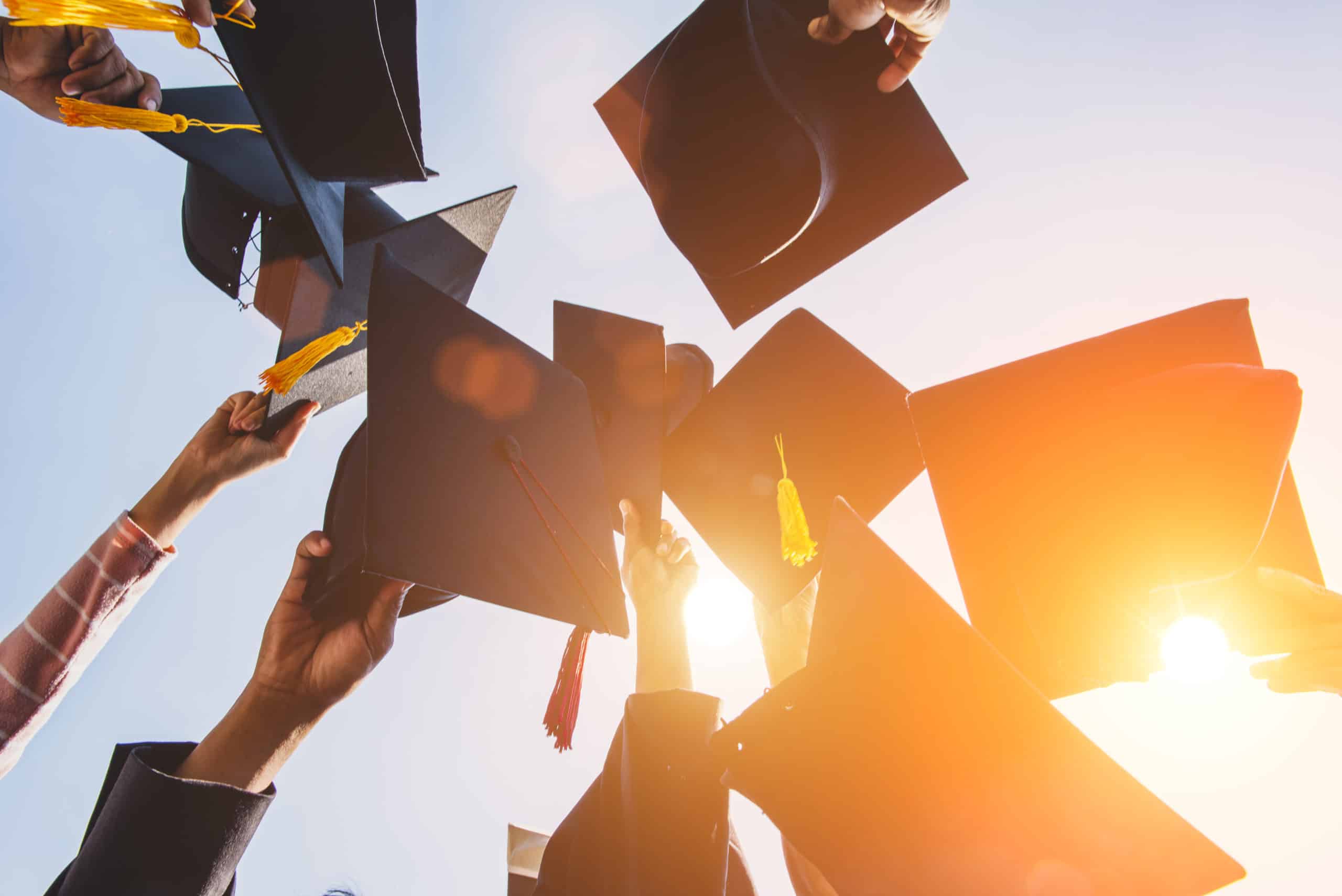 graduates-throw-hat-diploma-ceremony-university-scaled