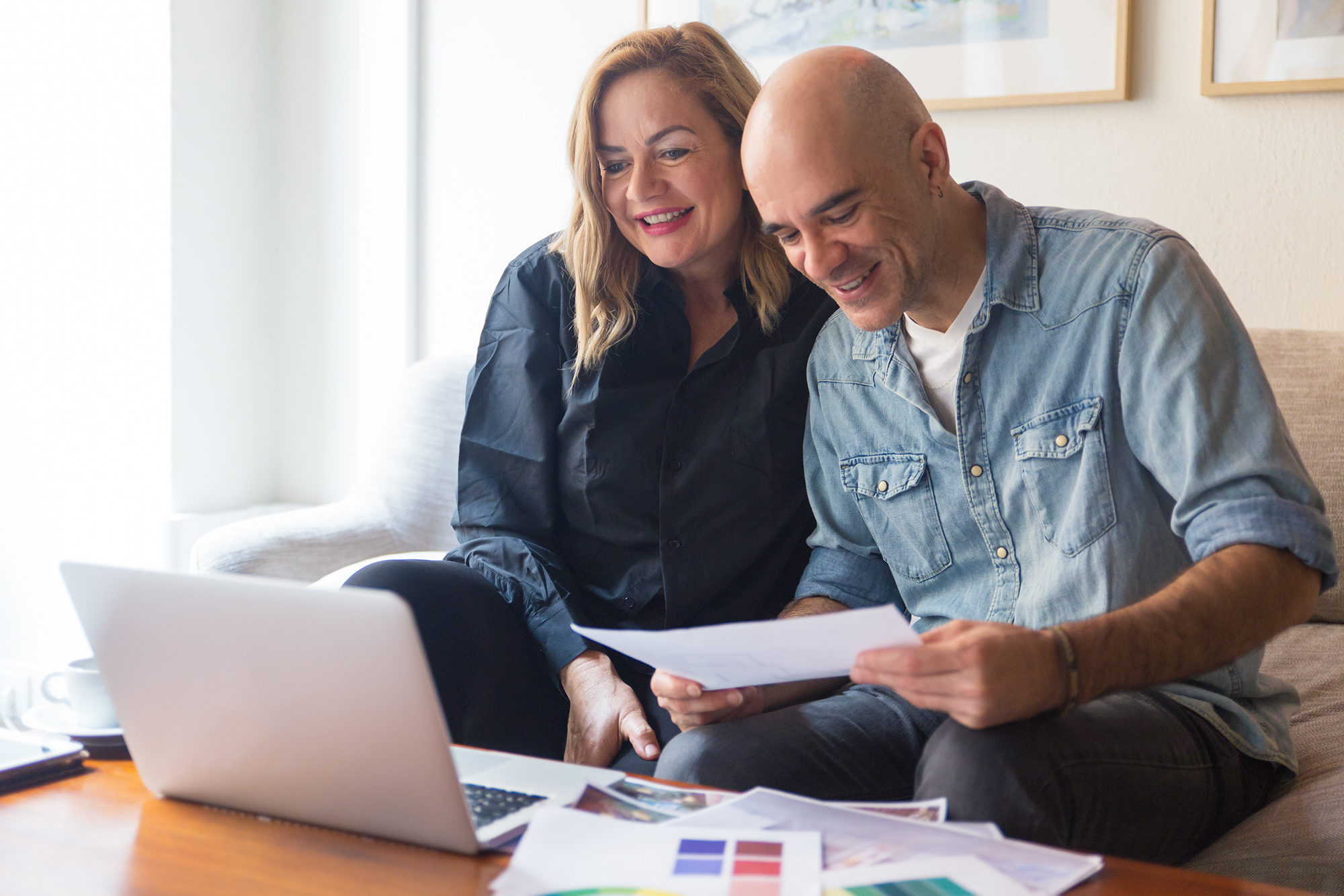 happy couple clients talking interior designer