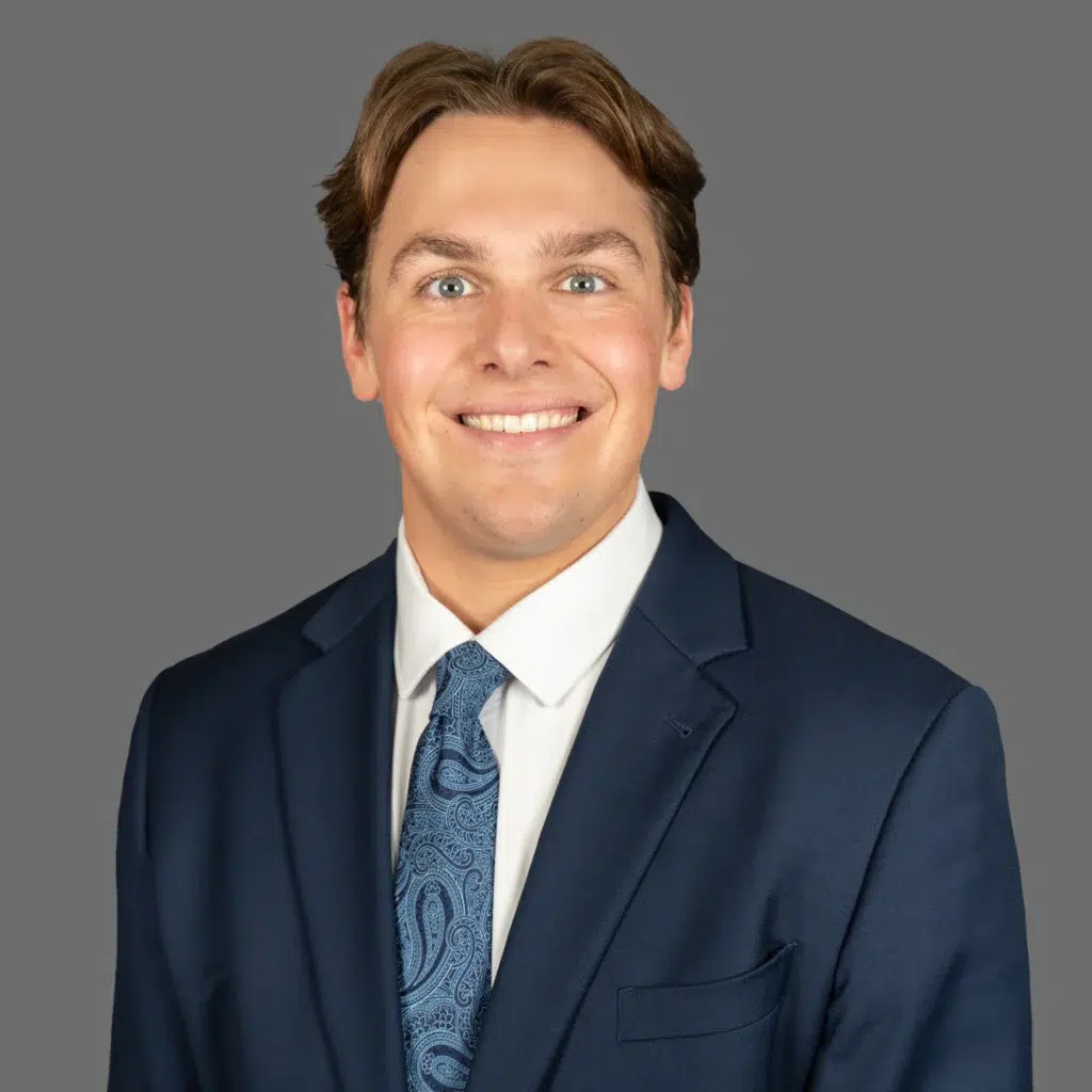 billy peterson smiling in a suit coat