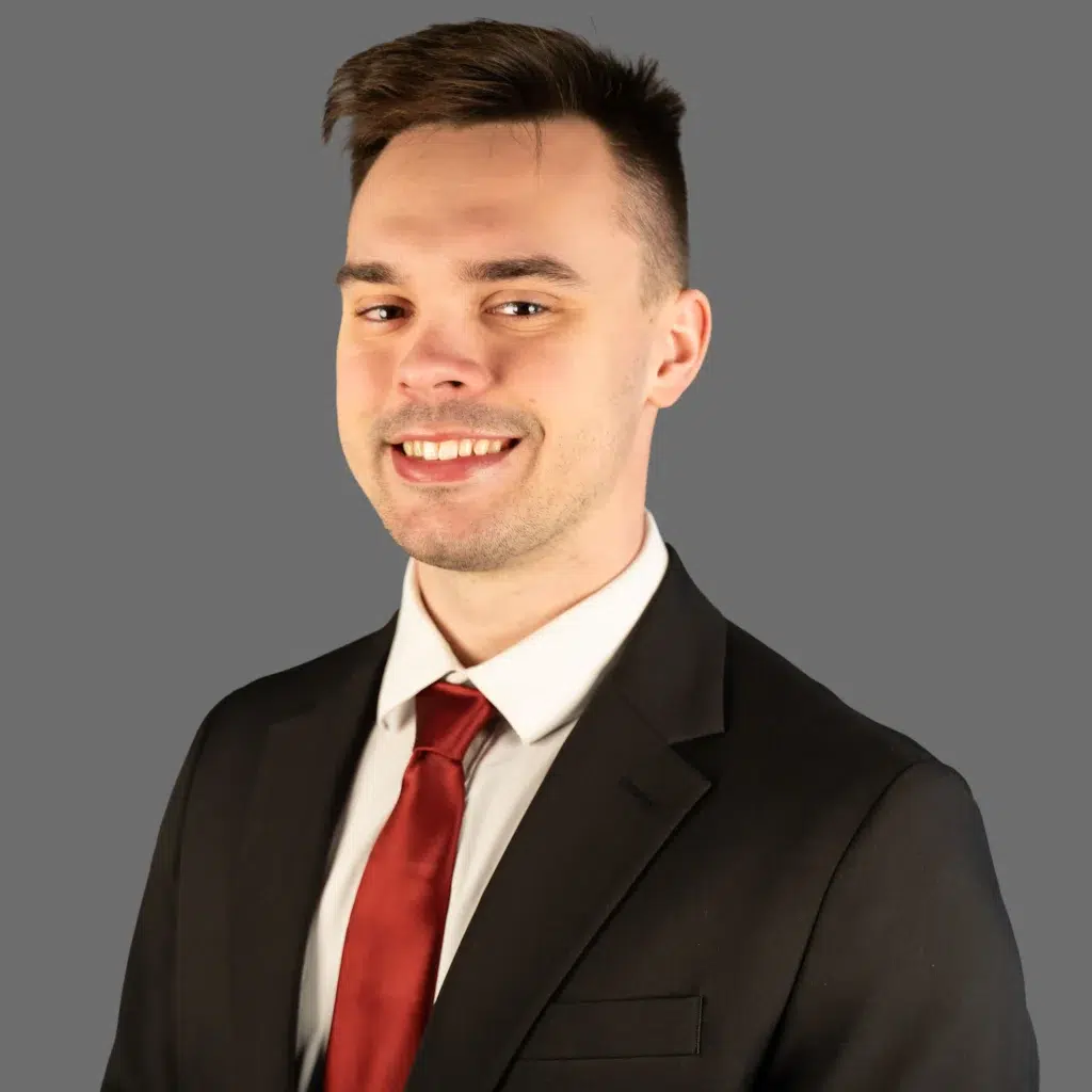 billy peterson smiling in a suit coat